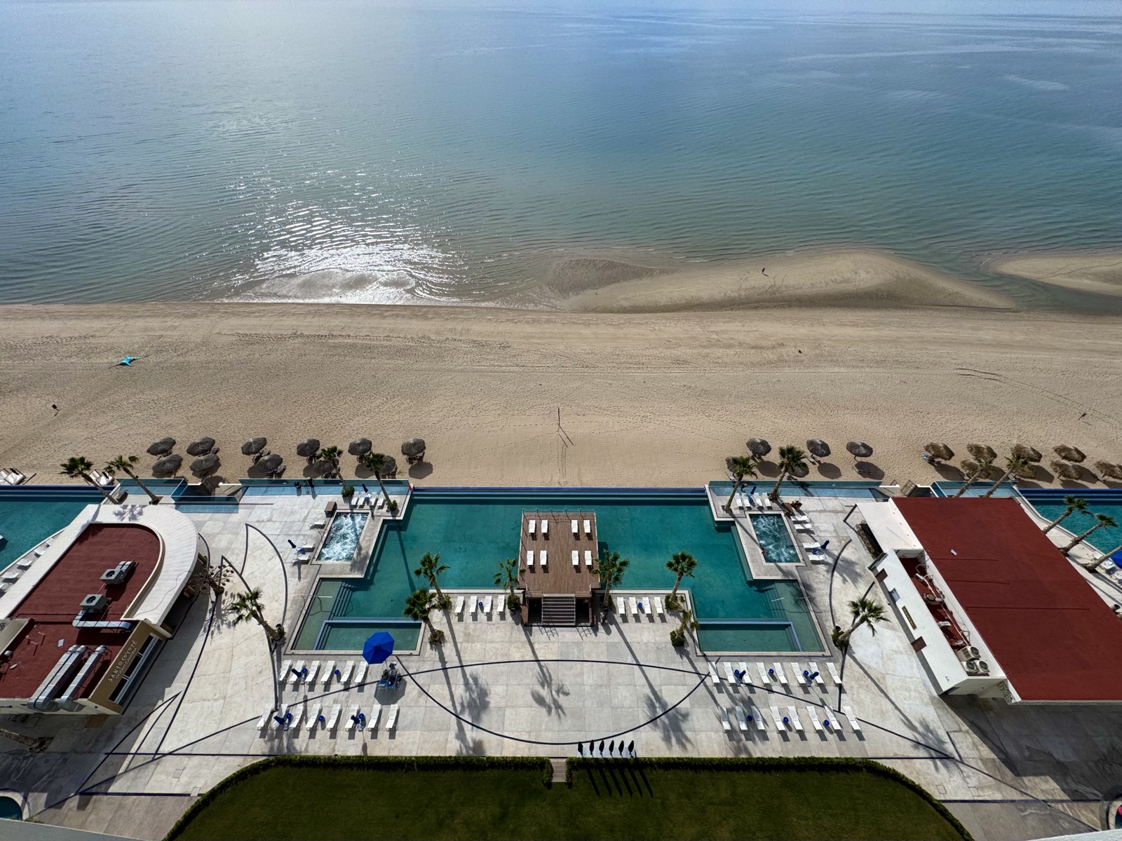 The pools and Playa Encanto seen from the balcony of Casa del Pulpo