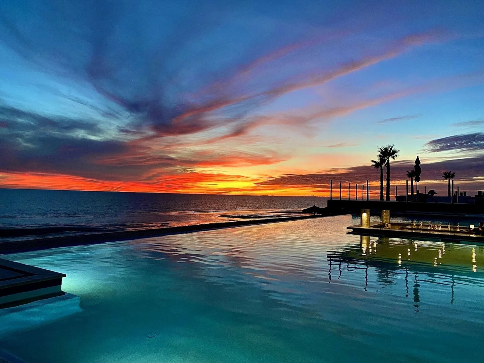 The infinity pool at Encantame Towers at sunset